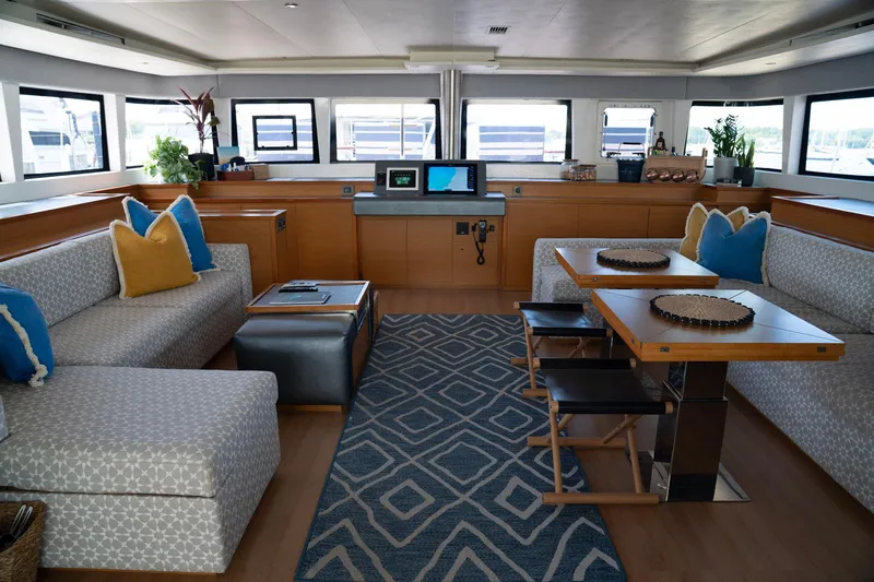 Andromeda Yacht Photos Pics Luxurious interior of 2016 Lagoon 620 yacht with modern seating and decor.