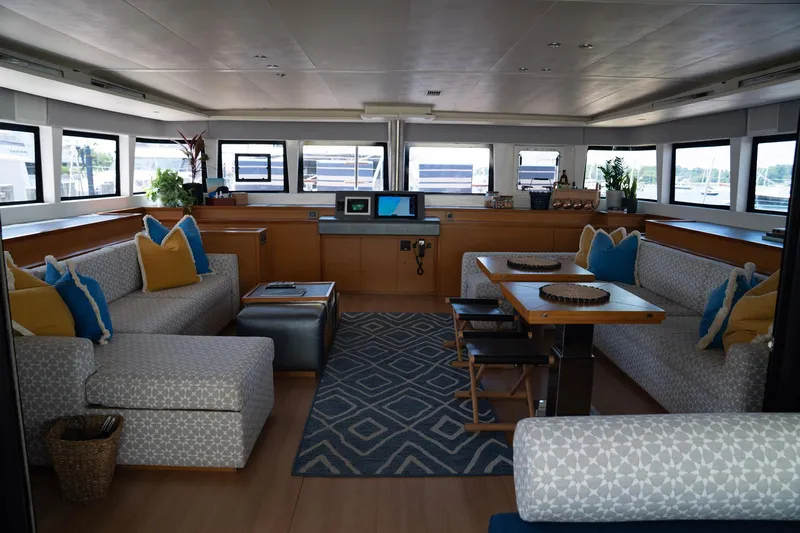 Andromeda Yacht Photos Pics Luxurious interior of 2016 Lagoon 620 yacht with modern furnishings and panoramic windows.