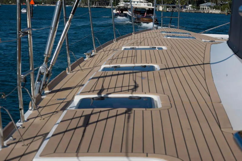 Andromeda Yacht Photos Pics Deck view of 2016 Lagoon 620 catamaran sailing on a sunny day.