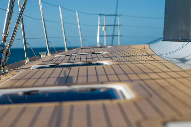 Andromeda Yacht Photos Pics Deck of 2016 Lagoon 620 yacht with wooden finish and ocean view.