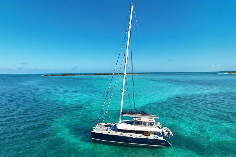 Andromeda Yacht Photos Pics Lagoon 620 catamaran sailing in clear turquoise waters, 2016 model.