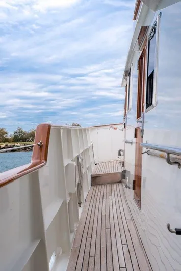 Atlantic Princess Yacht Photos Pics Side deck of 1992 Custom GeTa 86ft Motor Yacht with wooden railings.