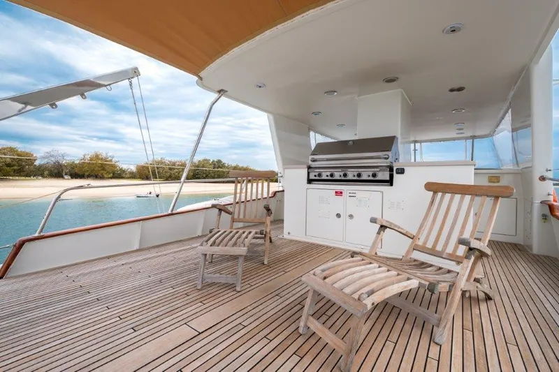 Atlantic Princess Yacht Photos Pics Deck of 1992 Custom GeTa 86ft Motor Yacht with chairs and grill.