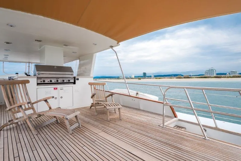 Atlantic Princess Yacht Photos Pics Deck view of 1992 GeTa 86ft Motor Yacht with seating and ocean backdrop.