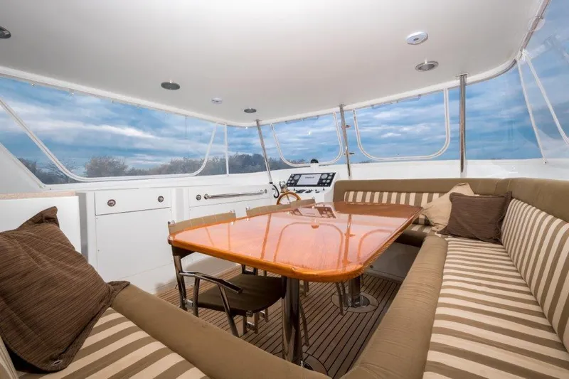 Atlantic Princess Yacht Photos Pics Luxurious interior of 1992 Custom GeTa 86ft Motor Yacht with elegant seating and table.