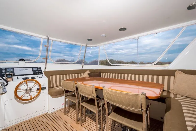 Atlantic Princess Yacht Photos Pics Luxurious interior of 1992 GeTa 86ft Motor Yacht with seating and navigation area.