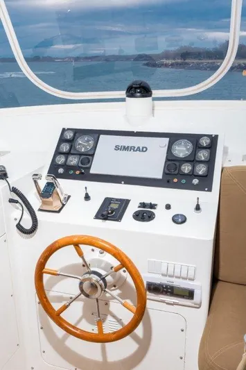 Atlantic Princess Yacht Photos Pics Helm of 1992 Custom GeTa 86ft Motor Yacht with Simrad navigation system.