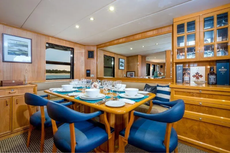 Atlantic Princess Yacht Photos Pics Luxurious dining area on 1992 GeTa 86ft Motor Yacht with elegant table setting.
