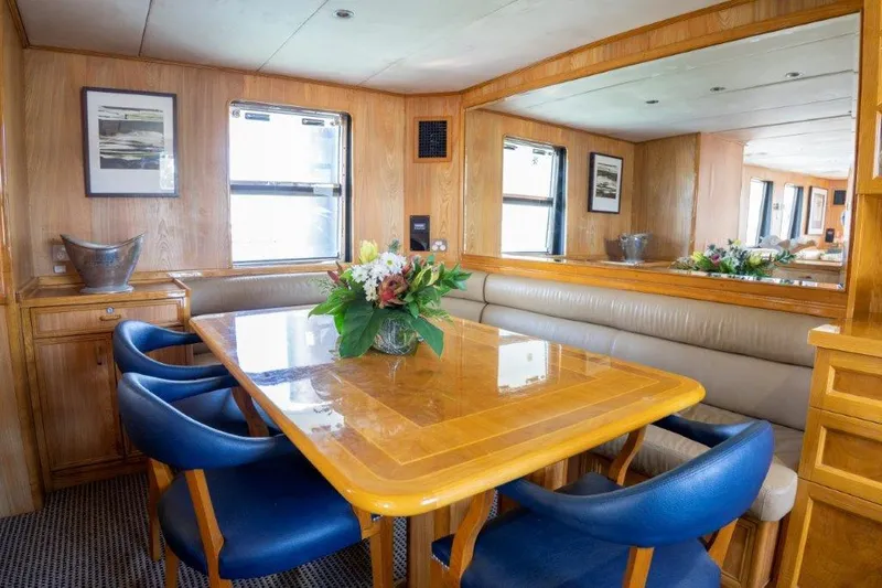 Atlantic Princess Yacht Photos Pics Luxurious dining area on a 1992 GeTa 86ft Motor Yacht with elegant wood finishes.