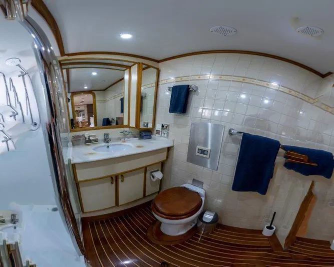 Atlantic Princess Yacht Photos Pics Luxurious bathroom on 1992 GeTa 86ft Motor Yacht with elegant wood accents and modern fixtures.