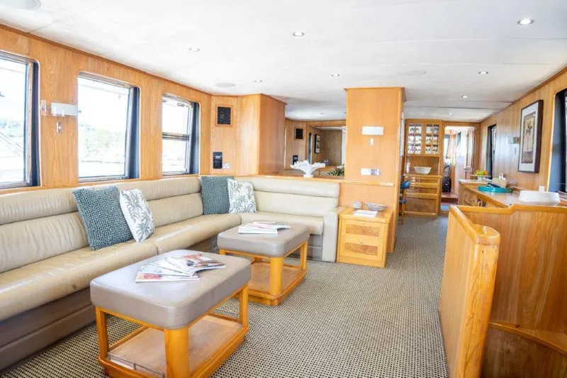Atlantic Princess Yacht Photos Pics Luxurious interior of 1992 GeTa 86ft Motor Yacht with elegant seating and wooden accents.