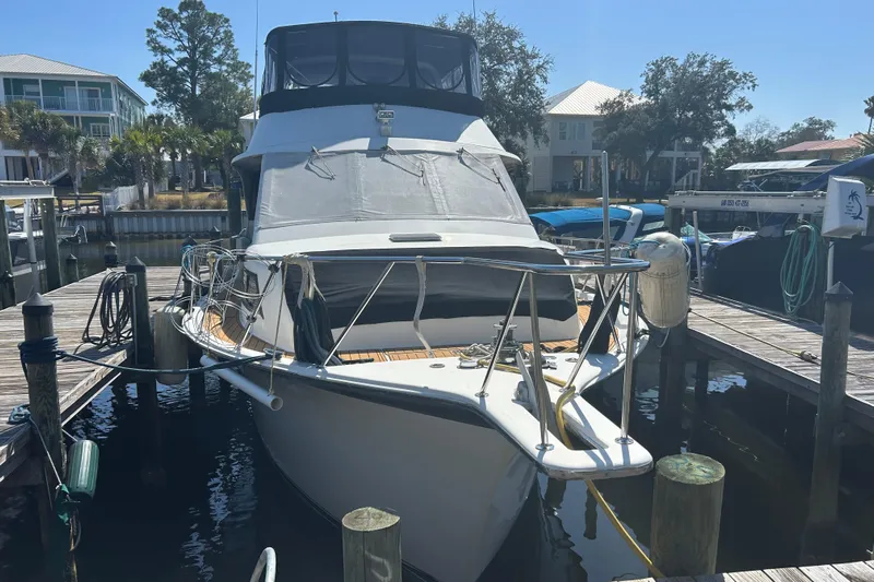 Seas The Dream Yacht Photos Pics 1989 Ocean 48 Motor Yacht docked at marina under clear blue sky.