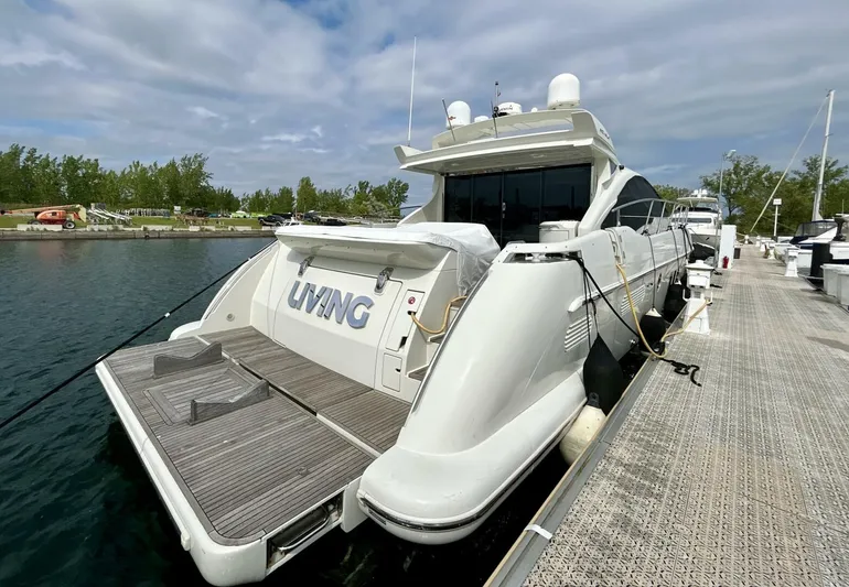  Yacht Photos Pics 2011 Azimut 62S Italia yacht docked at marina, rear view.