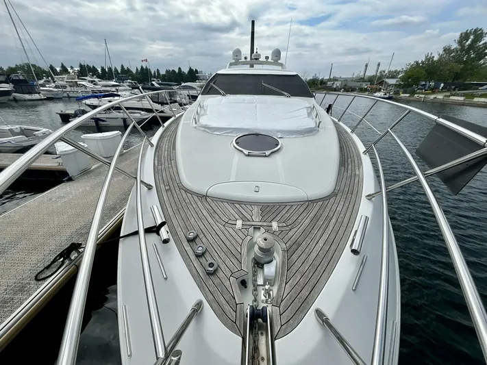  Yacht Photos Pics Azimut 62S Italia 2011 yacht docked at marina, showcasing sleek design and wooden deck.