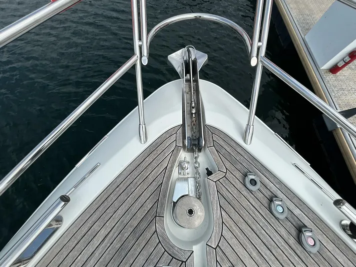  Yacht Photos Pics Bow of 2011 Azimut 62S Italia yacht with stainless steel railings and teak decking.