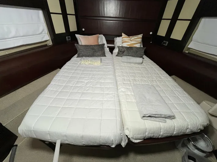  Yacht Photos Pics Interior of 2011 Azimut 62S Italia yacht with twin beds and modern decor.