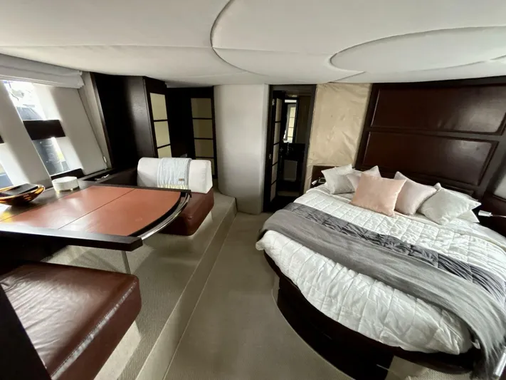  Yacht Photos Pics Luxurious interior of 2011 Azimut 62S Italia yacht with bed and seating area.