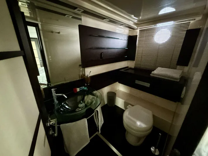  Yacht Photos Pics Luxurious bathroom interior of 2011 Azimut 62S Italia yacht with modern fixtures.