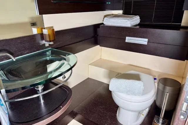  Yacht Photos Pics Luxurious bathroom in 2011 Azimut 62S Italia yacht with modern fixtures and elegant design.