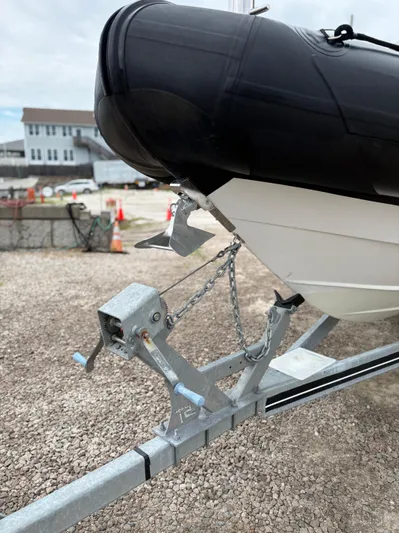  Yacht Photos Pics 2020 Protector 310 Targa boat on trailer, close-up of bow and anchor.
