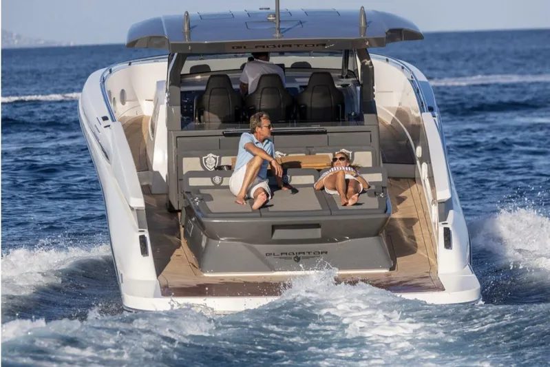  Yacht Photos Pics 2026 Canados GLADIATOR 493 GRAND yacht cruising with passengers relaxing on deck.