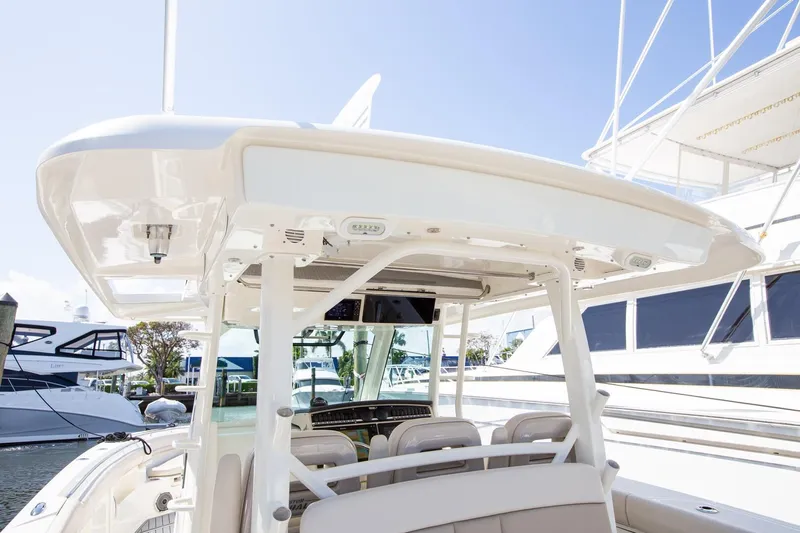  Yacht Photos Pics 2019 Boston Whaler 380 Outrage boat interior, featuring helm and seating area.