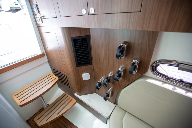  Yacht Photos Pics Interior of 2019 Boston Whaler 380 Outrage, featuring wooden cabinetry and seating.