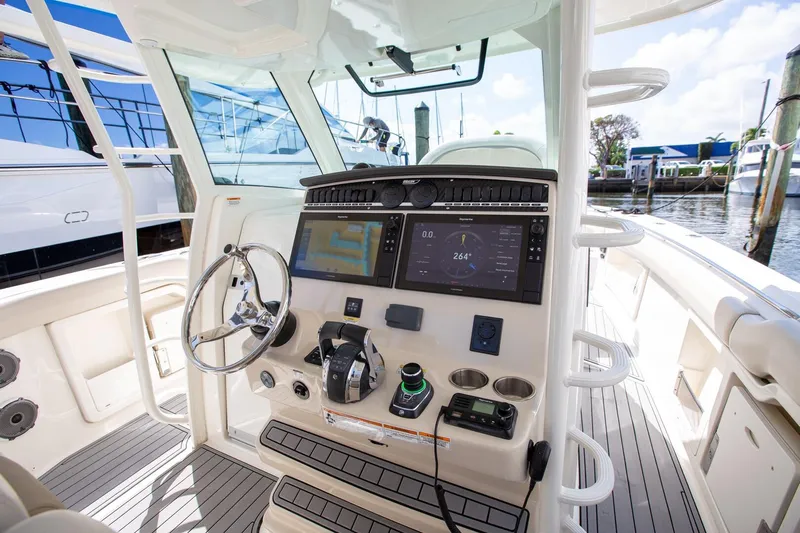  Yacht Photos Pics 2019 Boston Whaler 380 Outrage helm with advanced navigation and control systems.