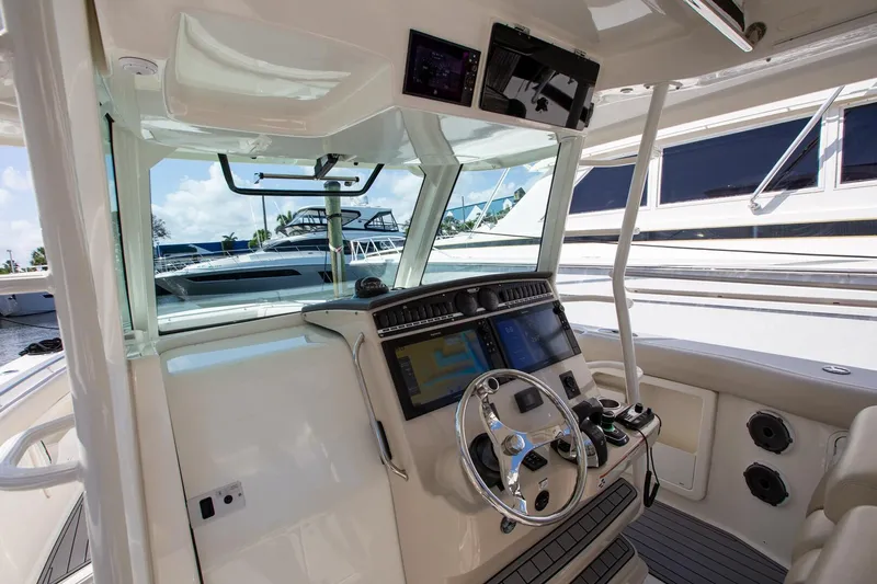  Yacht Photos Pics 2019 Boston Whaler 380 Outrage helm with advanced navigation systems and luxurious design.