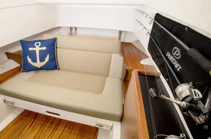  Yacht Photos Pics Manufacturer Provided Image: Interior of 2019 Pursuit S 328 Sport boat with beige seating and anchor pillow.