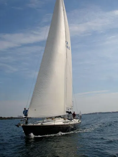 Blue Yacht Photos Pics Sailing yacht C&C 51 XL C/B 1994 on open water under clear skies.