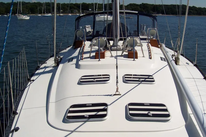 Blue Yacht Photos Pics Sailing yacht C&C 51 XL C/B 1994 on calm water, showcasing deck and rigging.