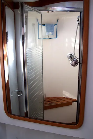 Blue Yacht Photos Pics Shower area in 1994 C&C 51 XL C/B yacht with wooden seat and glass door.