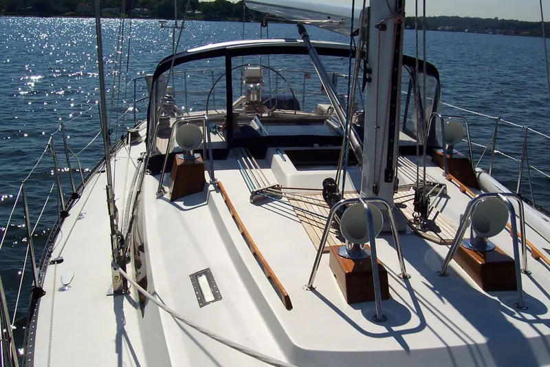 Blue Yacht Photos Pics Sailing yacht C&C 51 XL C/B, 1994 model, on calm waters under clear skies.