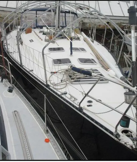 Blue Yacht Photos Pics Sailboat C&C 51 XL C/B 1994 docked, featuring sleek design and spacious deck.