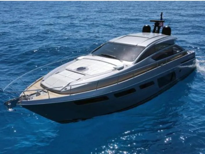Our Trade Yacht Photos Pics 2022 Pershing 6X yacht cruising on clear blue ocean waters.