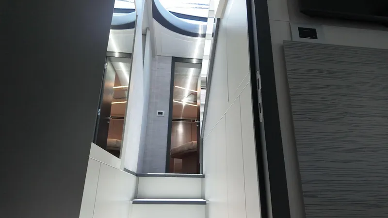 Our Trade Yacht Photos Pics Interior view of 2022 Pershing 6X yacht, featuring modern design and sleek finishes.