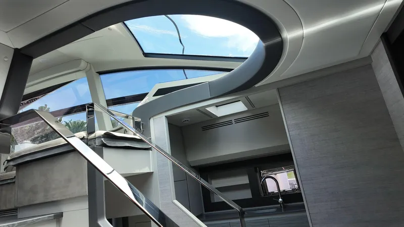 Our Trade Yacht Photos Pics Luxurious interior of 2022 Pershing 6X yacht with modern design and skylight.