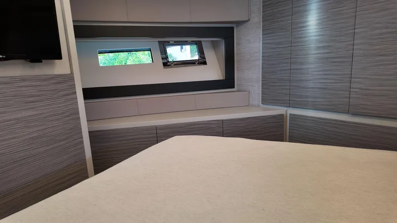 Our Trade Yacht Photos Pics Luxurious interior of 2022 Pershing 6X yacht with modern design and sleek cabinetry.