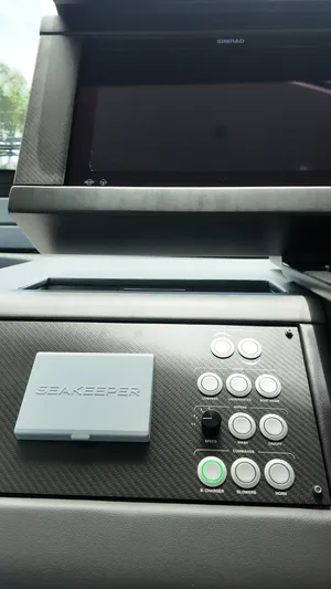 Our Trade Yacht Photos Pics Control panel of a 2022 Pershing 6X yacht with Seakeeper and Simrad systems.