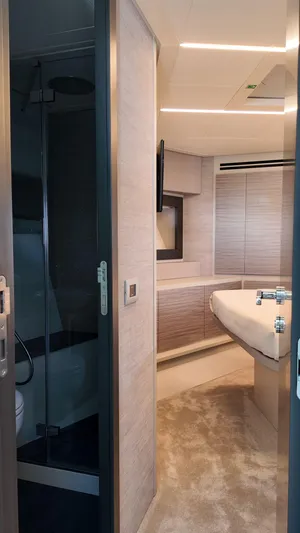 Our Trade Yacht Photos Pics Luxurious interior of 2022 Pershing 6X yacht featuring modern design and elegant furnishings.