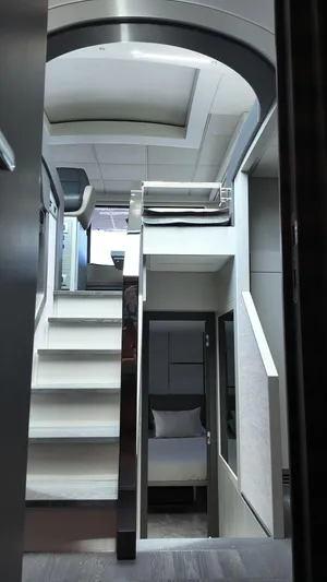Our Trade Yacht Photos Pics Interior of 2022 Pershing 6X yacht, featuring modern staircase and sleek design elements.