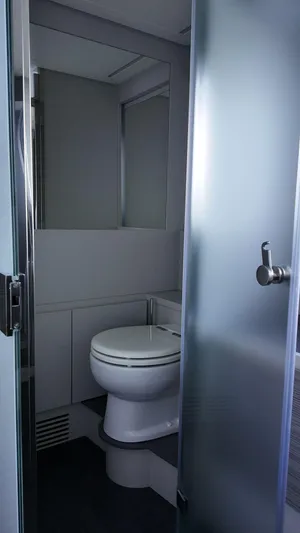 Our Trade Yacht Photos Pics Modern bathroom in 2022 Pershing 6X yacht with frosted glass door and sleek design.