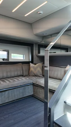 Our Trade Yacht Photos Pics Luxurious interior of 2022 Pershing 6X yacht with modern seating and sleek design.