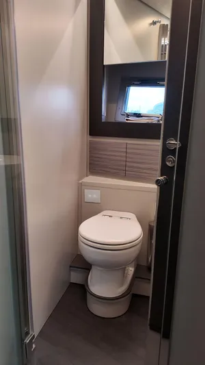 Our Trade Yacht Photos Pics Modern bathroom interior in 2022 Pershing 6X yacht, featuring sleek design and compact layout.