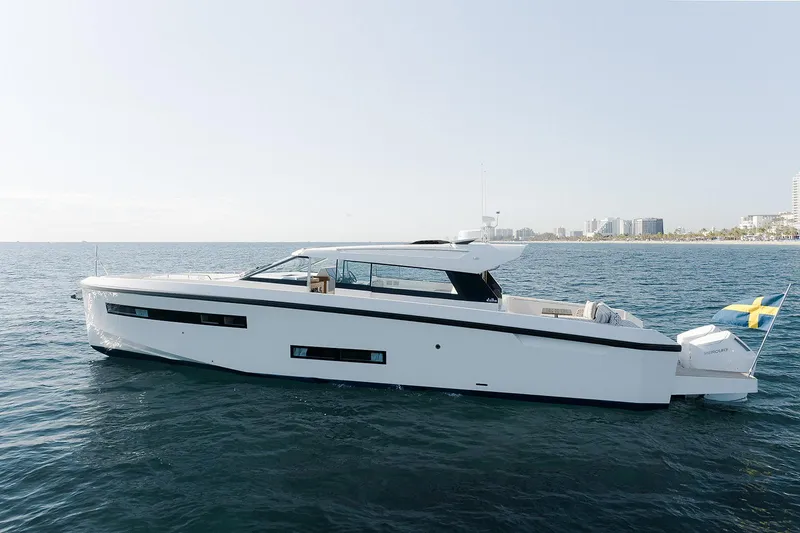 Yacht Photos Pics Delta Powerboats 48 Coupe 2026 yacht on open water, sleek design, Swedish flag displayed.