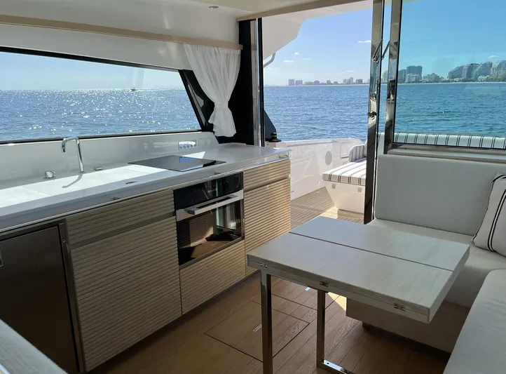  Yacht Photos Pics Interior of 2026 Delta Powerboats 48 Coupe with ocean view and modern kitchen.