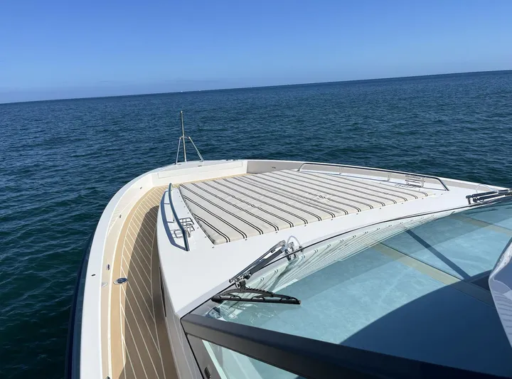  Yacht Photos Pics 2026 Delta Powerboats 48 Coupe on open sea, showcasing sleek deck design.
