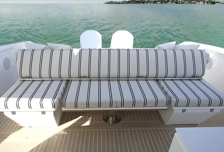  Yacht Photos Pics Luxury seating on 2026 Delta Powerboats 48 Coupe, overlooking serene waters.
