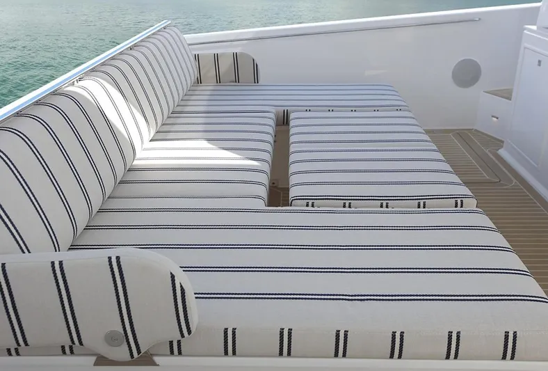  Yacht Photos Pics Striped seating on 2026 Delta Powerboats 48 Coupe deck, overlooking water.